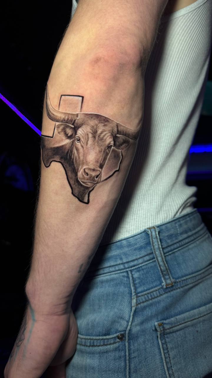 Fine line bull tattoo