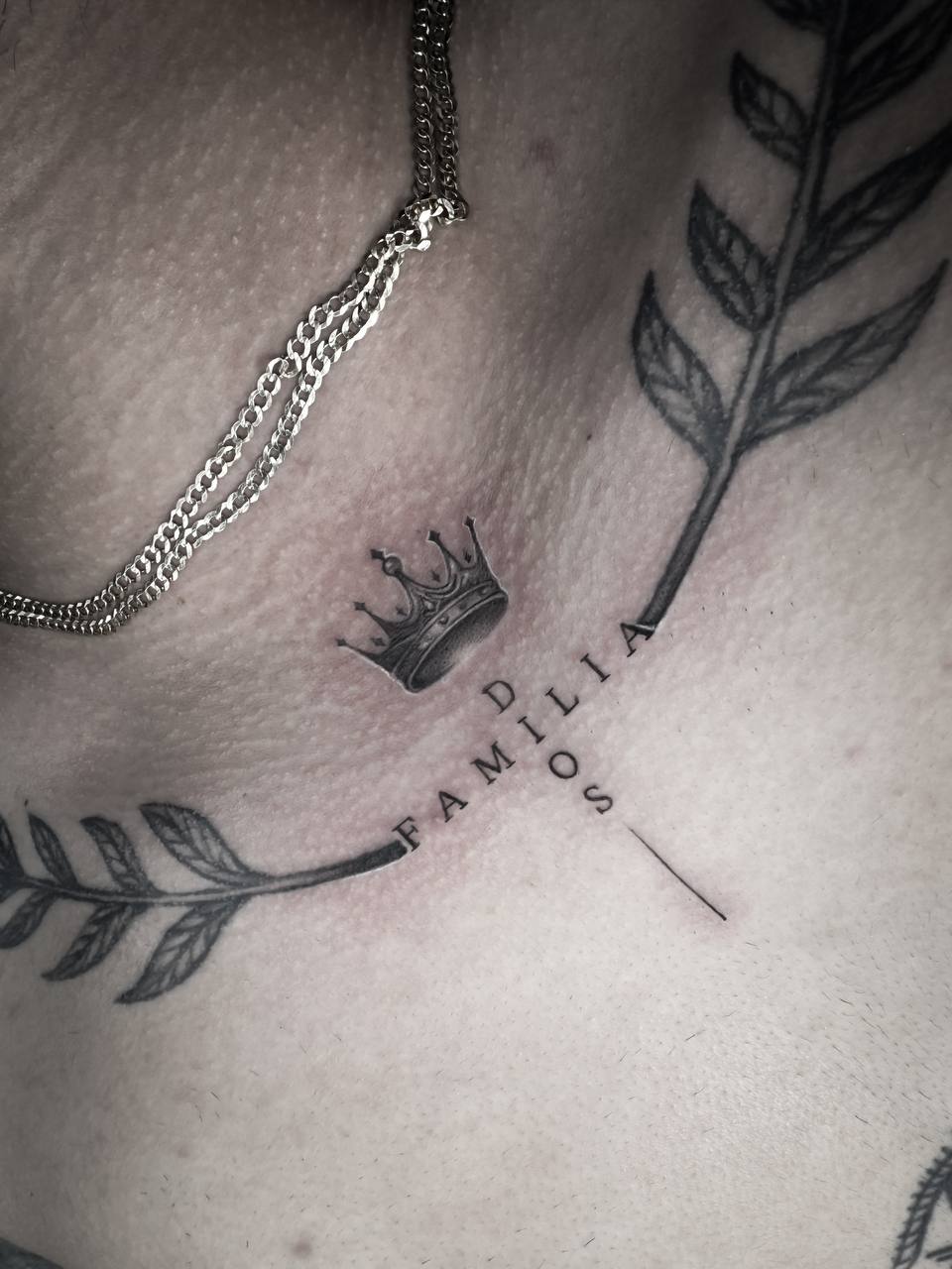 Fine line crown and lettering tattoo