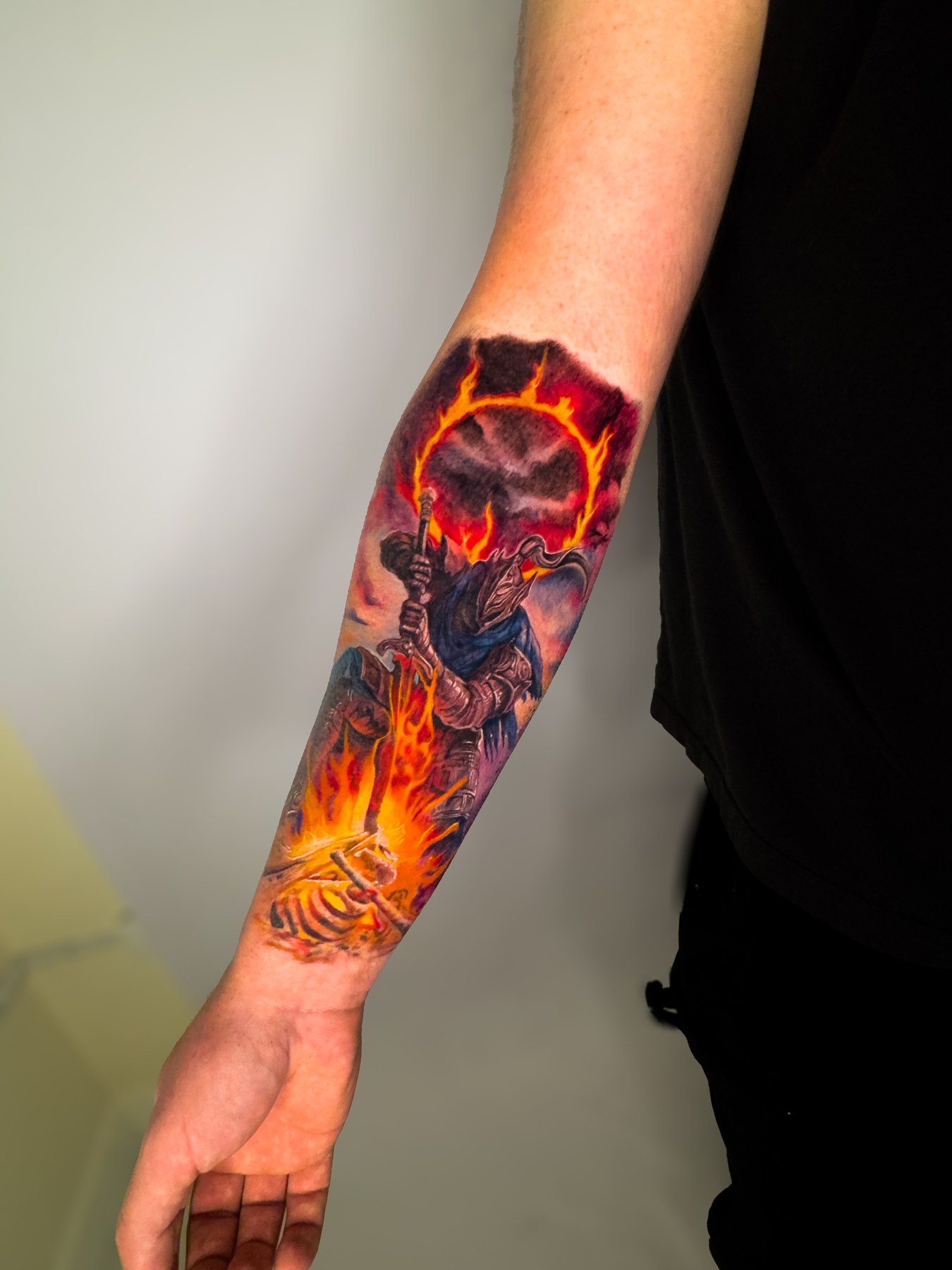 Armored figure with a sword and orange flames on a forearm